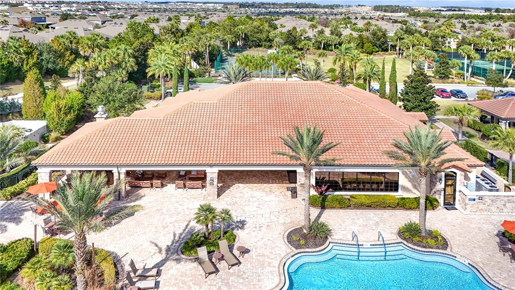 1284 Zeek Ridge Street Clermont, FL 34715 - Photo 29 of 35 an aerial view of a house with swimming pool garden and patio