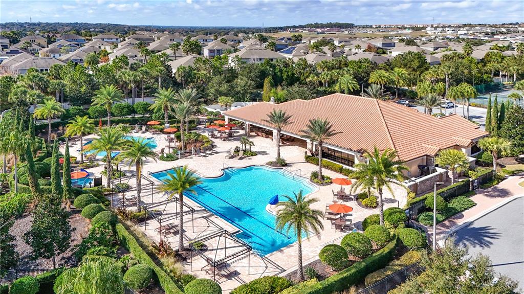 1284 Zeek Ridge Street Clermont, FL 34715 - Photo 31 of 35 an aerial view of a house with a yard and lake view