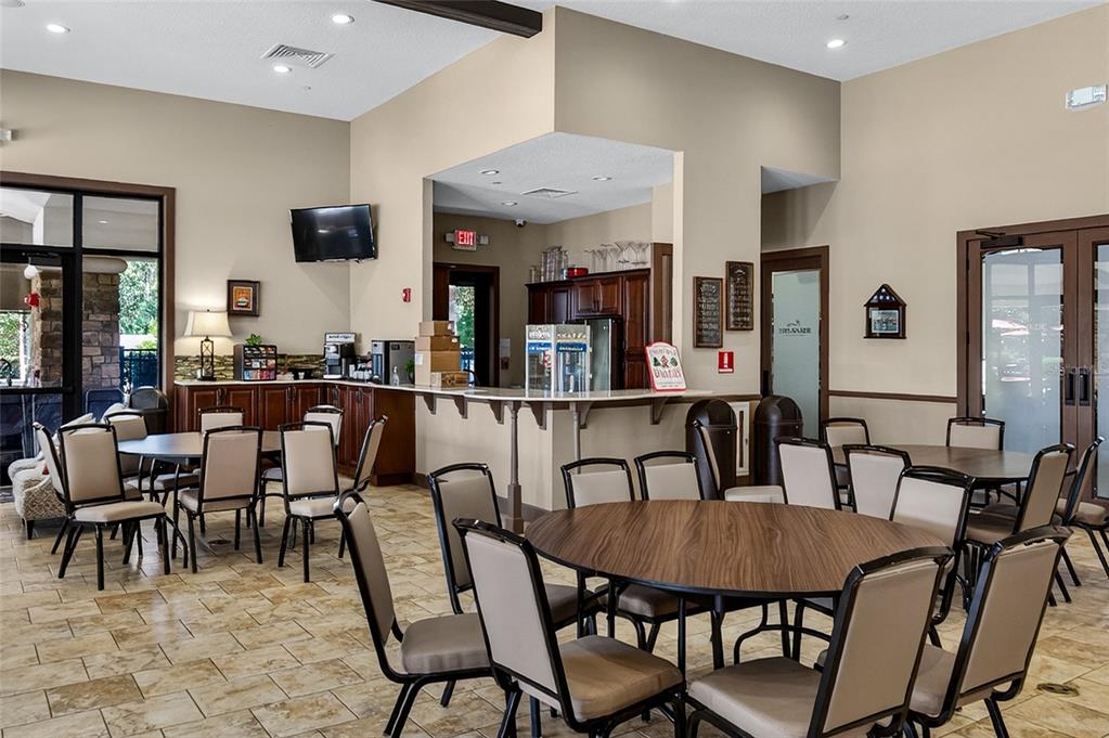 1284 Zeek Ridge Street Clermont, FL 34715 - Photo 34 of 35 a view of a dining area with furniture