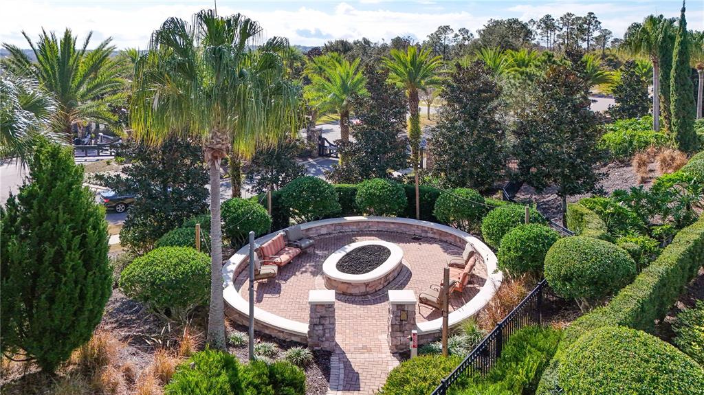 1284 Zeek Ridge Street Clermont, FL 34715 - Photo 35 of 35 a view of a white house with a trees in front of it