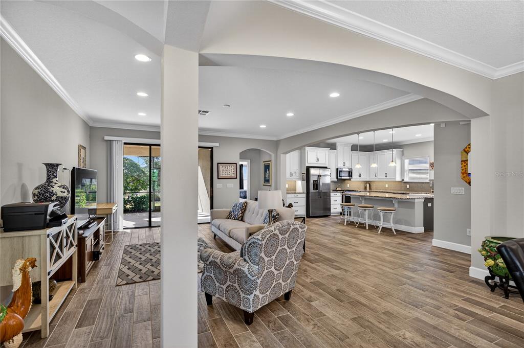 1284 Zeek Ridge Street Clermont, FL 34715 - Photo 4 of 35 a living room with furniture and a flat screen tv