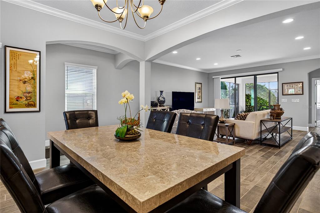 1284 Zeek Ridge Street Clermont, FL 34715 - Photo 5 of 35 a view of a dining room with furniture