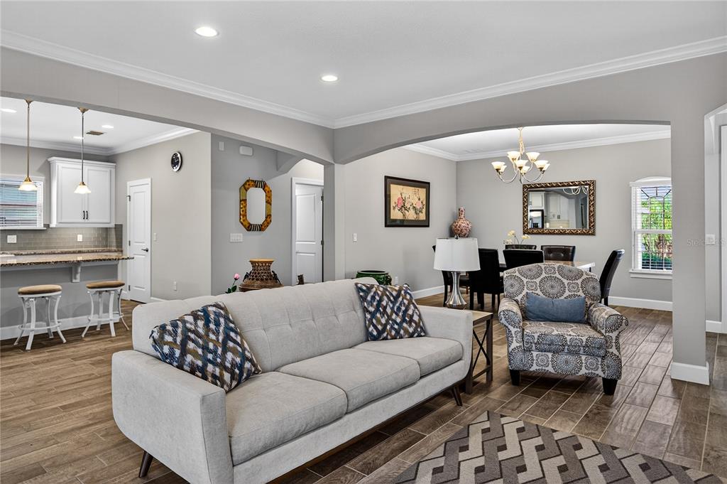 1284 Zeek Ridge Street Clermont, FL 34715 - Photo 9 of 35 a living room with furniture and wooden floor