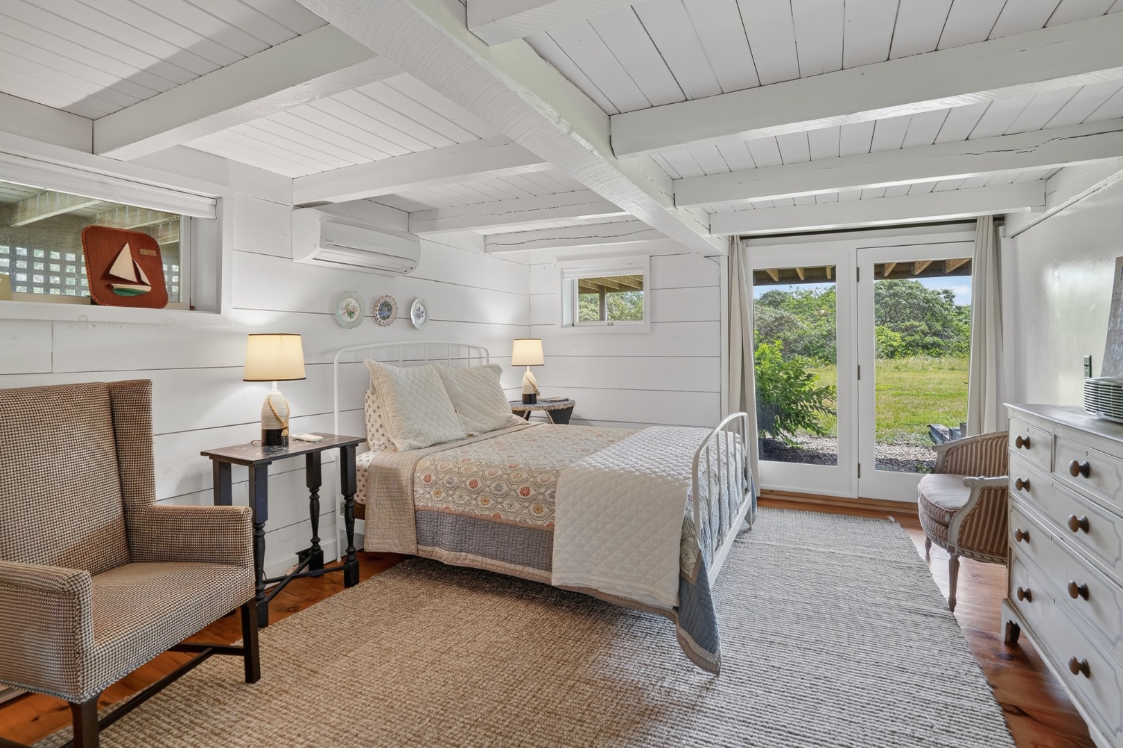 28 Black Point Road Chilmark, MA 02535 - Photo 24 of 56 Lower-level bedroom with en suite bath and sliders out to the yard.