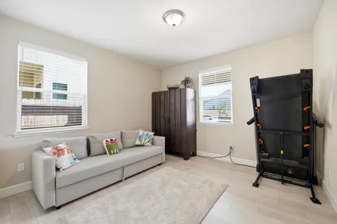 a living room with furniture and a window