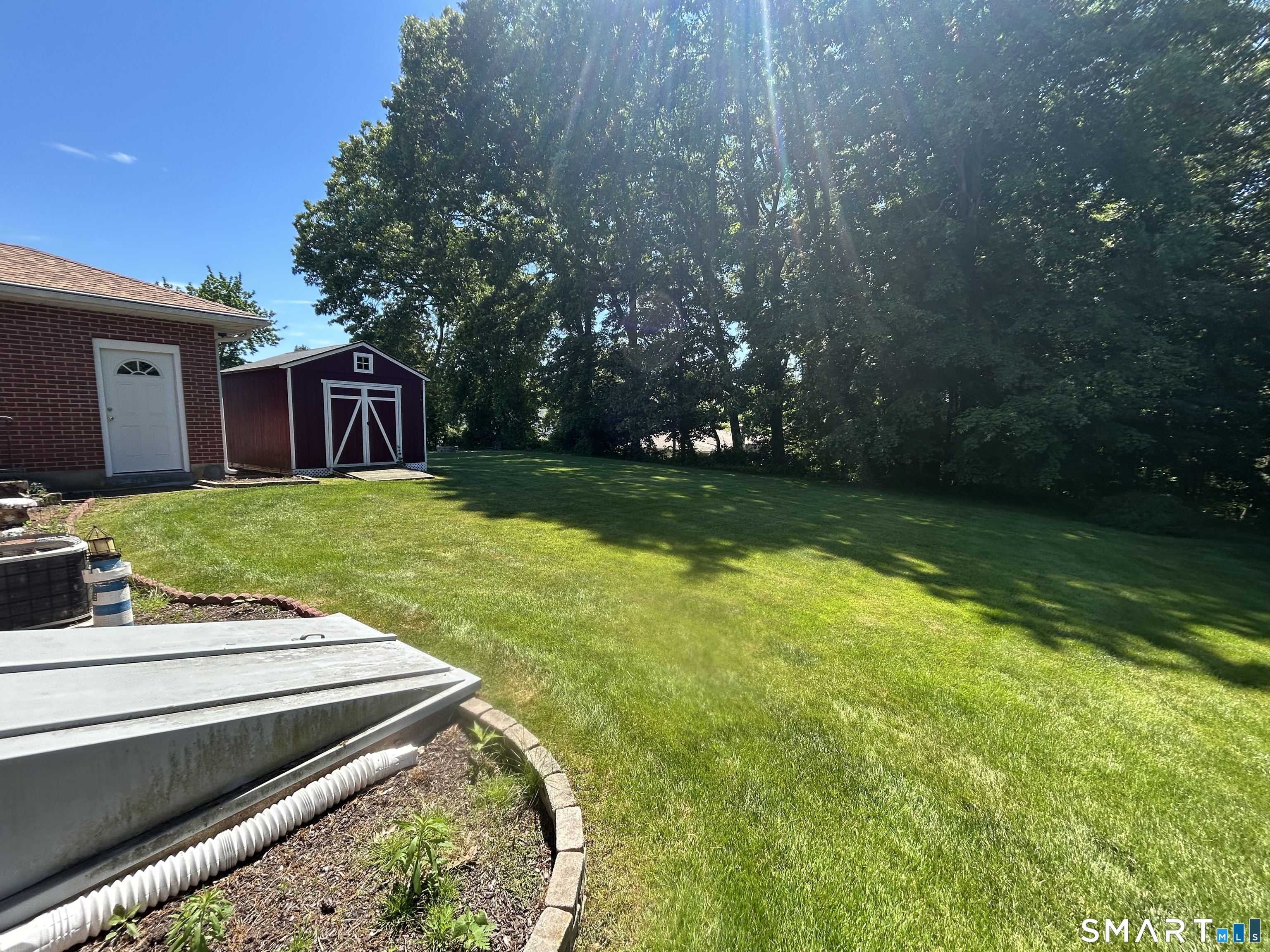 13 Walnut Lane Wallingford, CT 06492 - Photo 23 of 27 a view of a backyard with garden