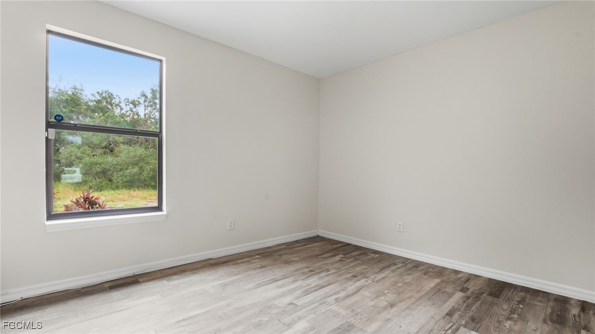 2701 East 18th Street Lehigh Acres, FL 33972 - Photo 15 of 23 a view of empty room with window