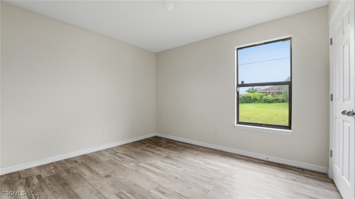 2701 East 18th Street Lehigh Acres, FL 33972 - Photo 17 of 23 an empty room with a window