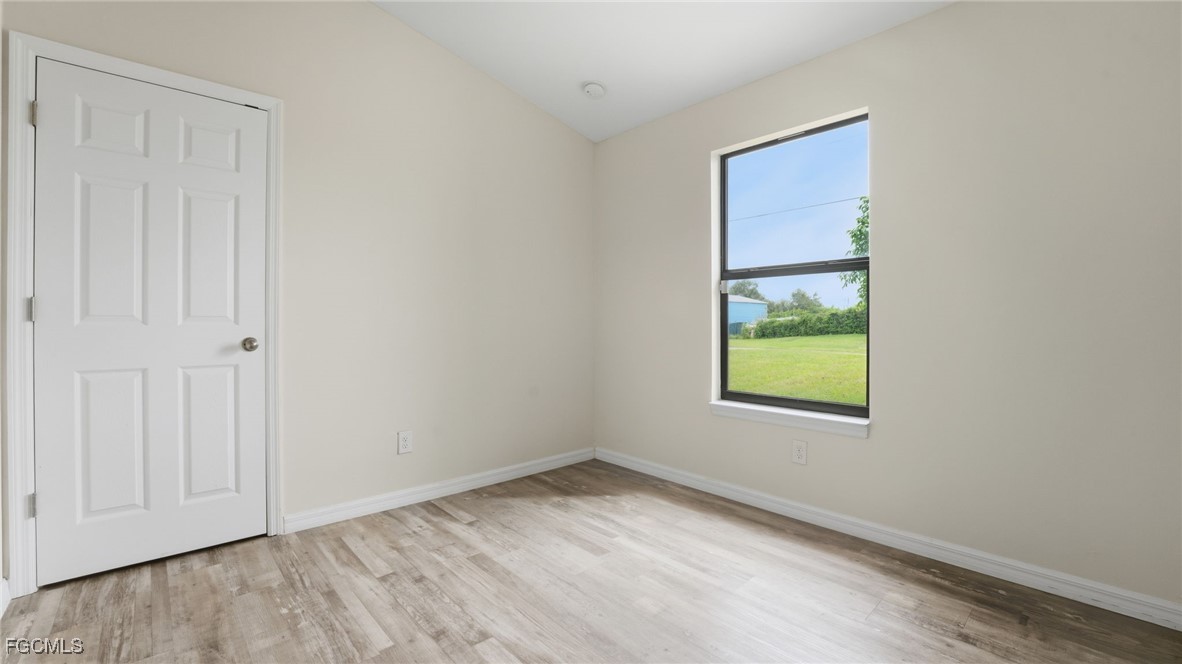 2701 East 18th Street Lehigh Acres, FL 33972 - Photo 19 of 23 an empty room with windows
