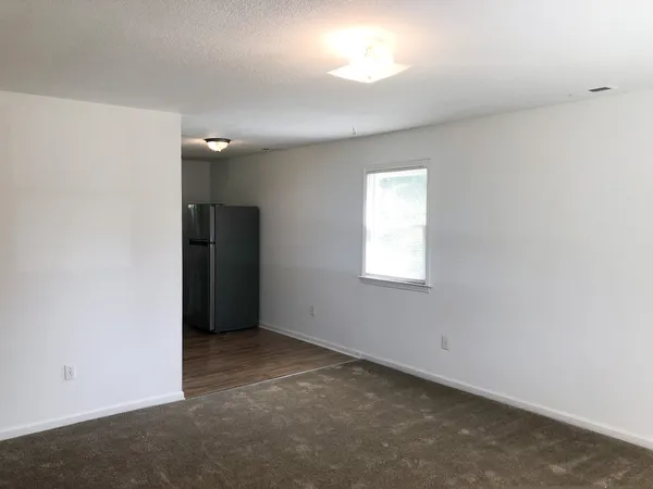 a view of cabinets and wooden floor