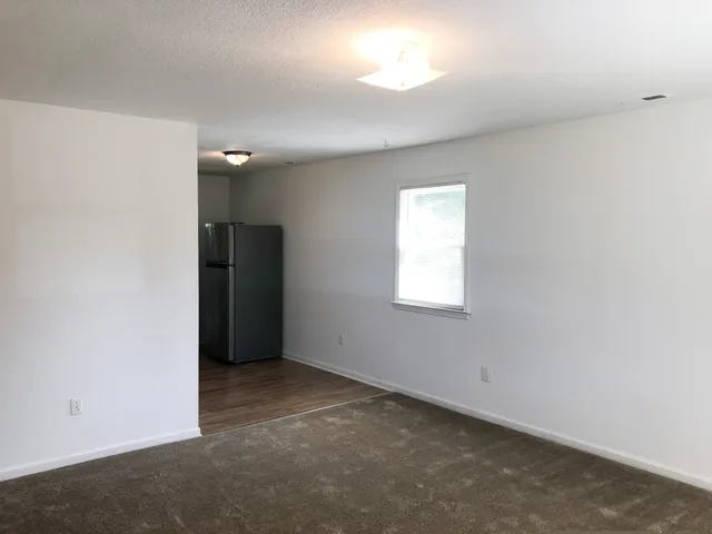 a view of cabinets and wooden floor