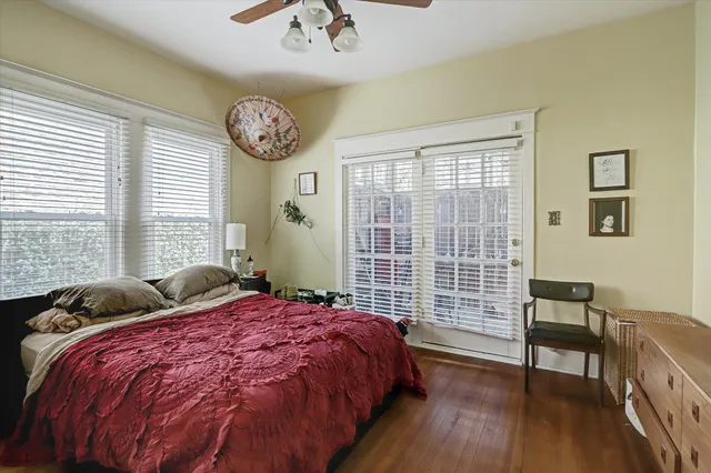 a bedroom with bed and a window
