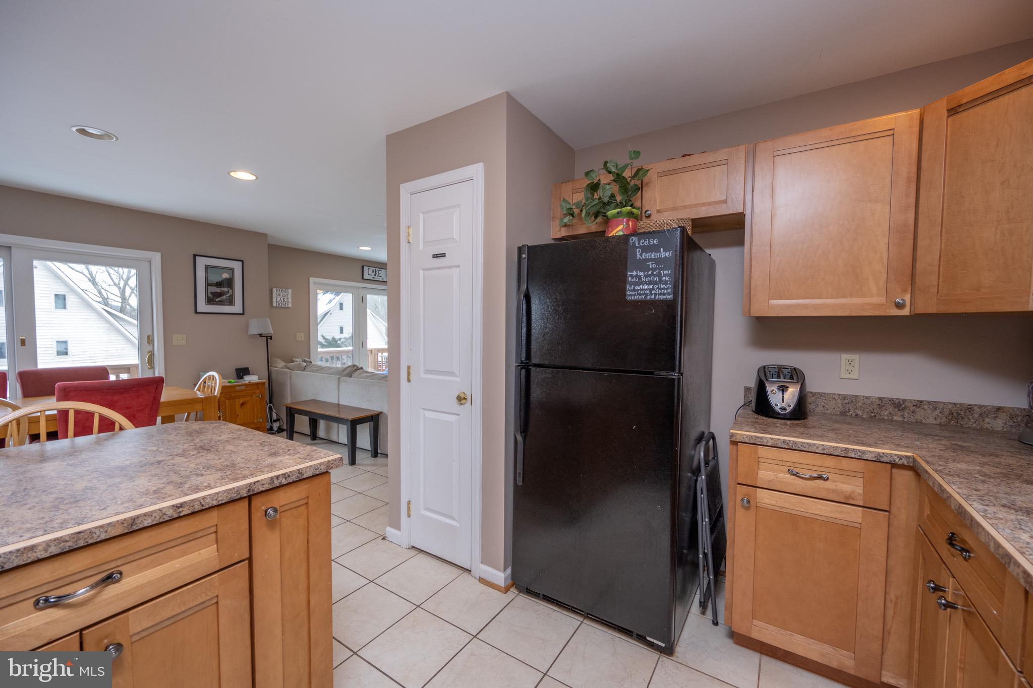 175 Roman Ridge Road, Unit 15 Oakland, MD 21550 - Photo 12 of 53 a kitchen with stainless steel appliances granite countertop a refrigerator and a stove top oven