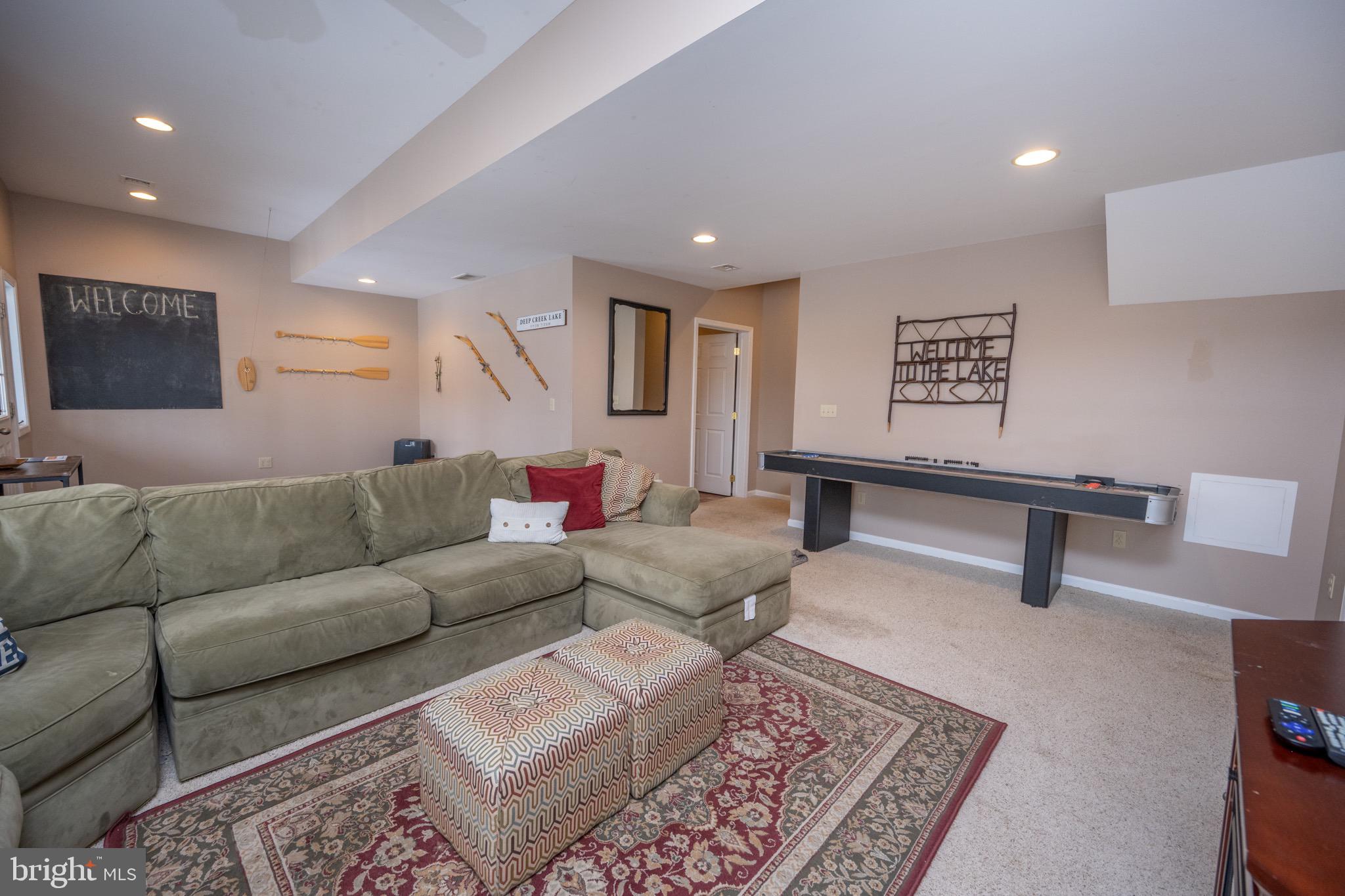 175 Roman Ridge Road, Unit 15 Oakland, MD 21550 - Photo 23 of 53 a living room with furniture and a rug