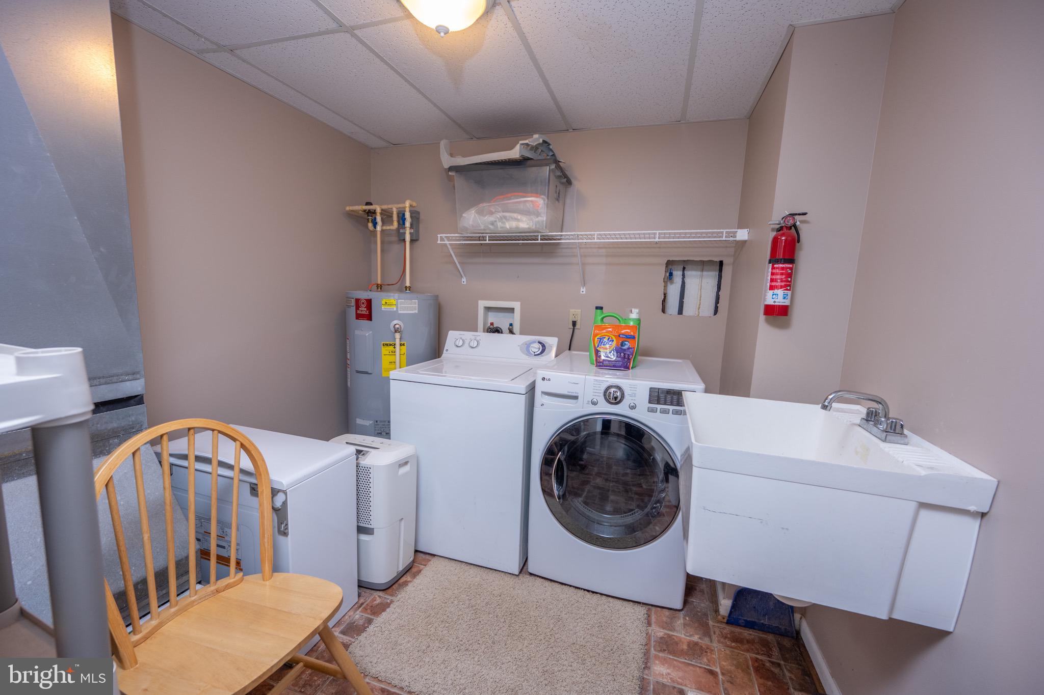 175 Roman Ridge Road, Unit 15 Oakland, MD 21550 - Photo 25 of 53 a utility room with dryer washer and dryer