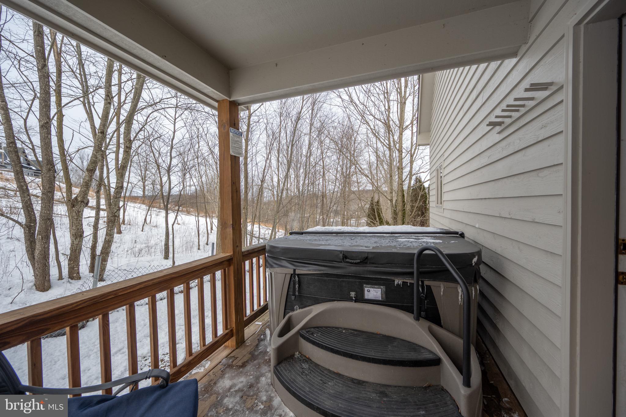 175 Roman Ridge Road, Unit 15 Oakland, MD 21550 - Photo 29 of 53 a bathroom with a sink and a view of balcony