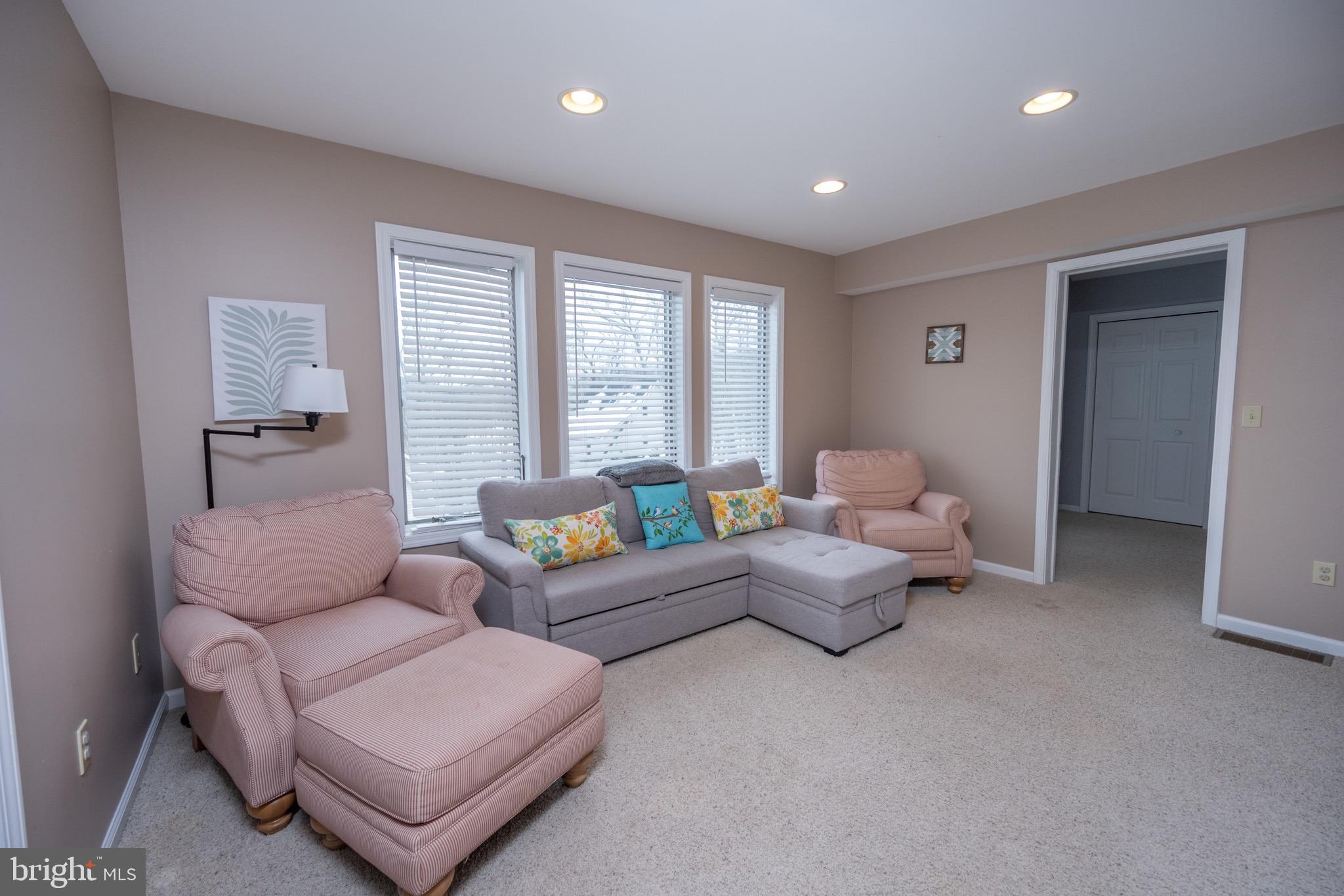 175 Roman Ridge Road, Unit 15 Oakland, MD 21550 - Photo 36 of 53 a living room with furniture and a large window