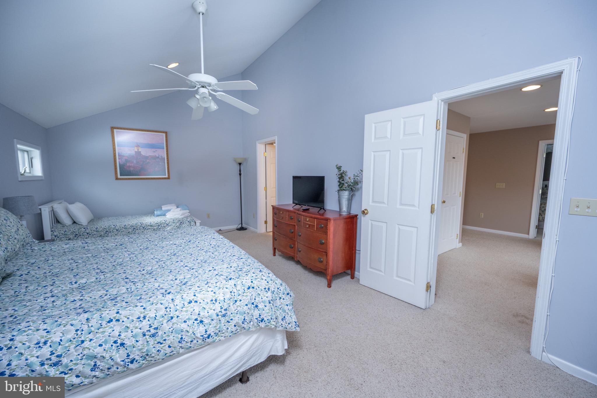 175 Roman Ridge Road, Unit 15 Oakland, MD 21550 - Photo 38 of 53 a bedroom with a bed and a flat screen tv