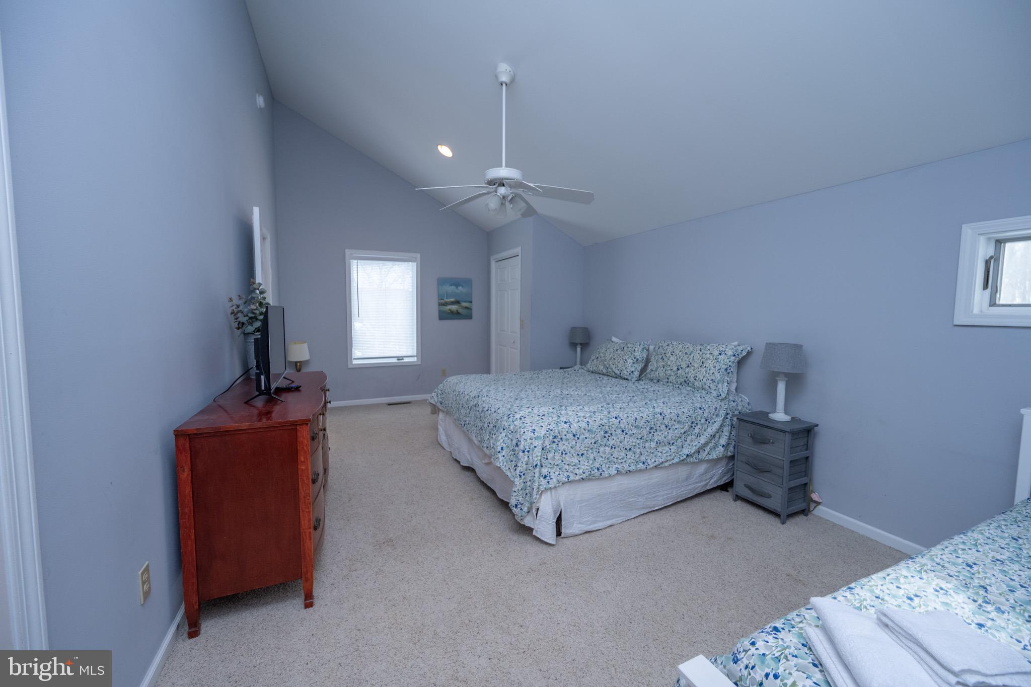 175 Roman Ridge Road, Unit 15 Oakland, MD 21550 - Photo 40 of 53 a bedroom with a bed and a chandelier