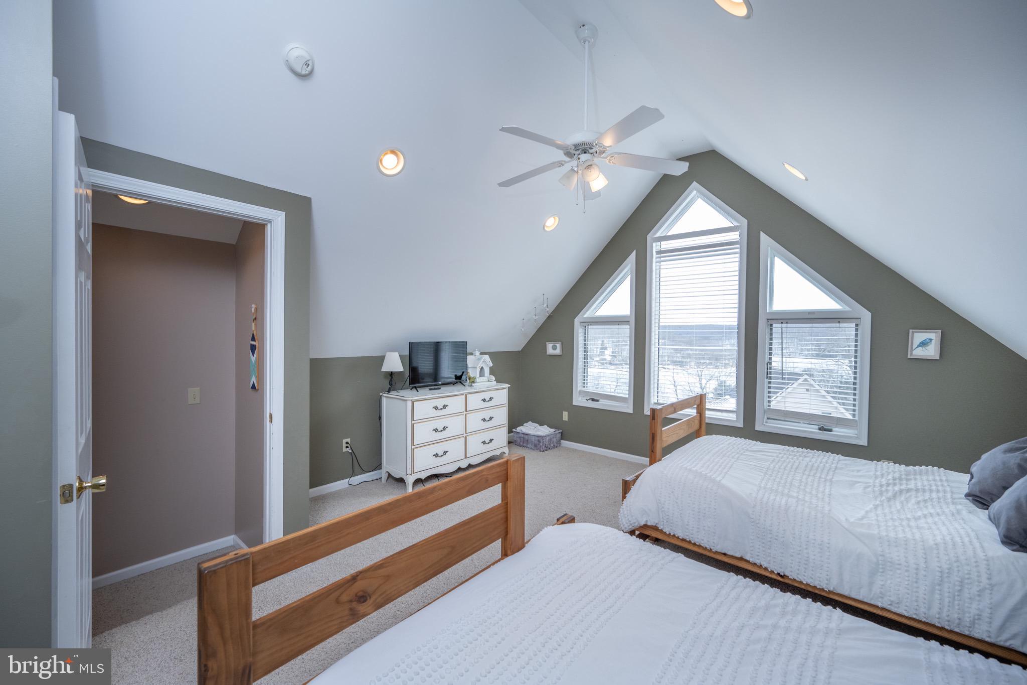 175 Roman Ridge Road, Unit 15 Oakland, MD 21550 - Photo 44 of 53 a bedroom with a bed and a large window