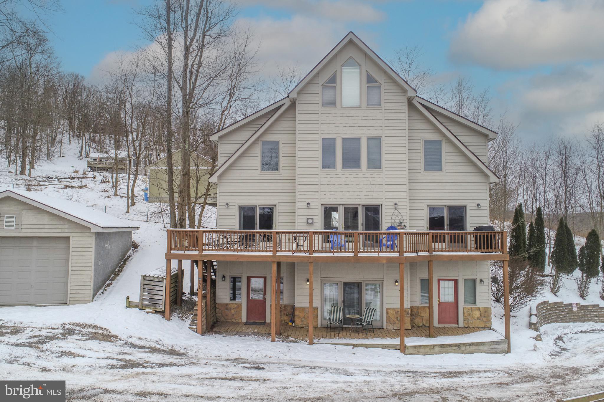 175 Roman Ridge Road, Unit 15 Oakland, MD 21550 - Photo 52 of 53 a view of a white apartments with large windows