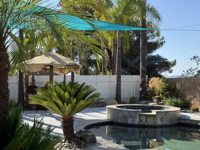an empty room with wooden floor and a hallway