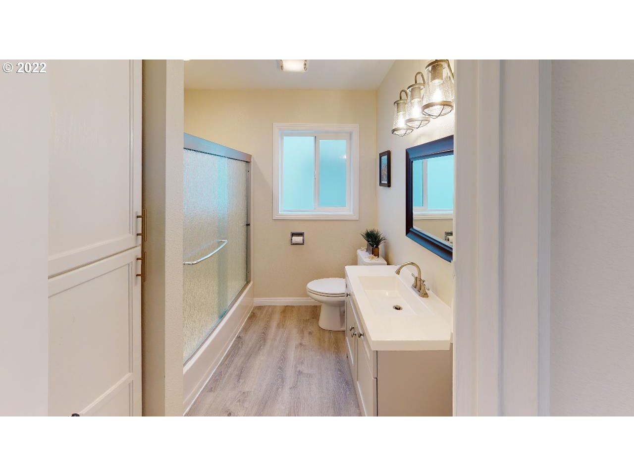 335 Mill Beach Road Brookings, OR 97415 - Photo 15 of 32 a bathroom with a sink a toilet and a mirror