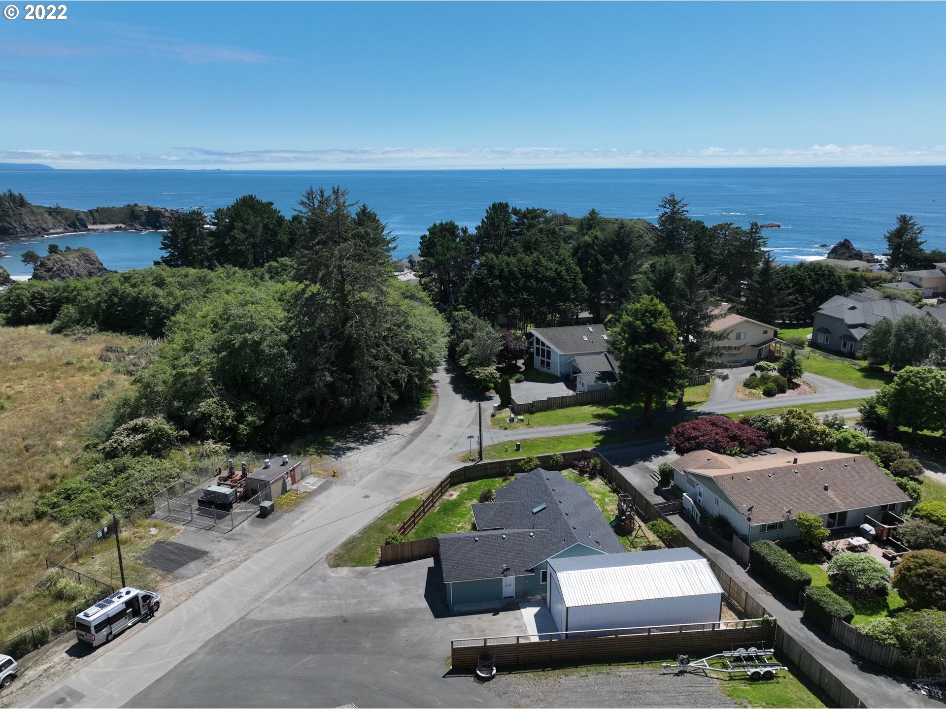 335 Mill Beach Road Brookings, OR 97415 - Photo 2 of 32 an aerial view of a swimming pool with a yard