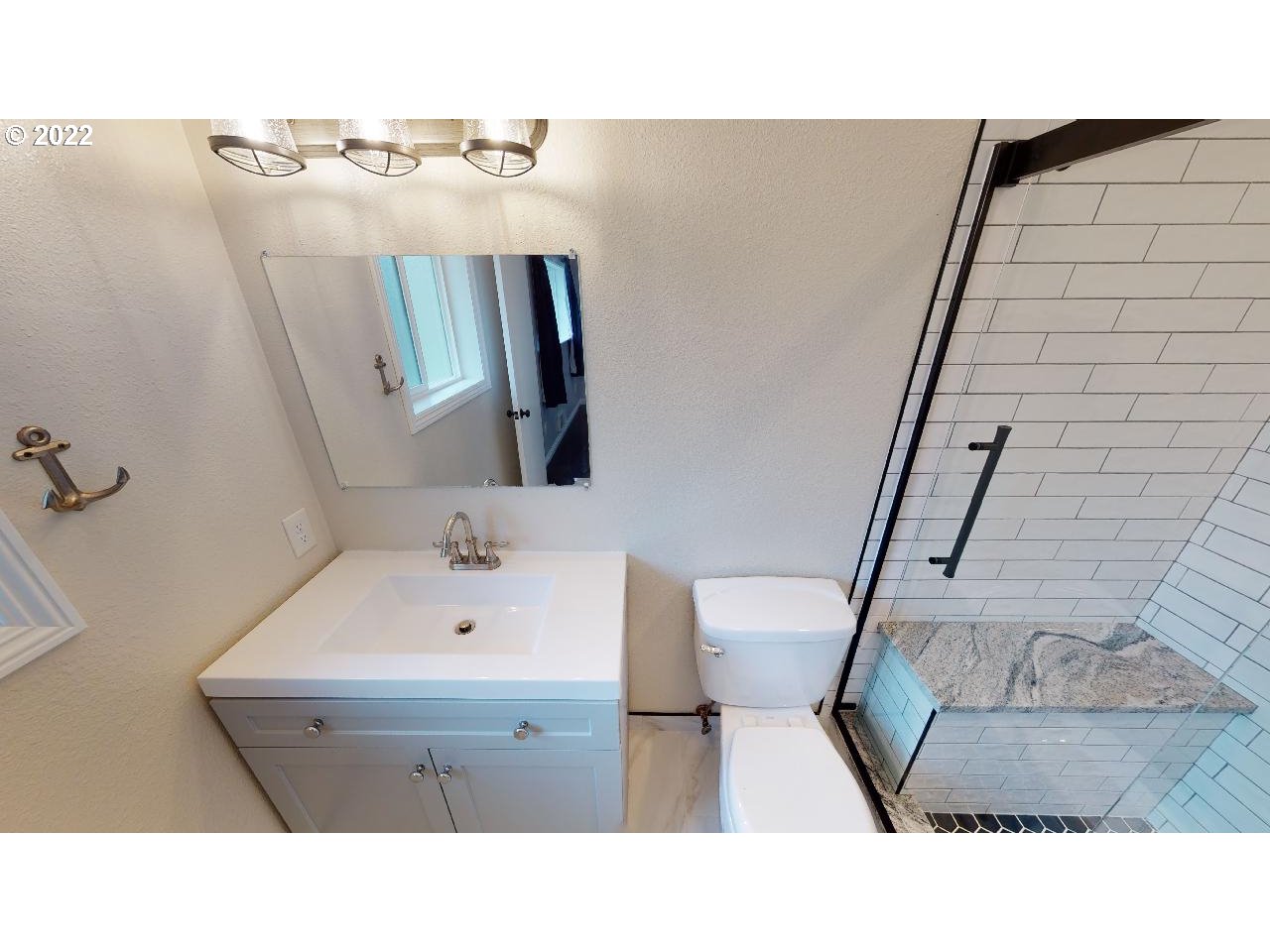335 Mill Beach Road Brookings, OR 97415 - Photo 22 of 32 a bathroom with a sink and mirror