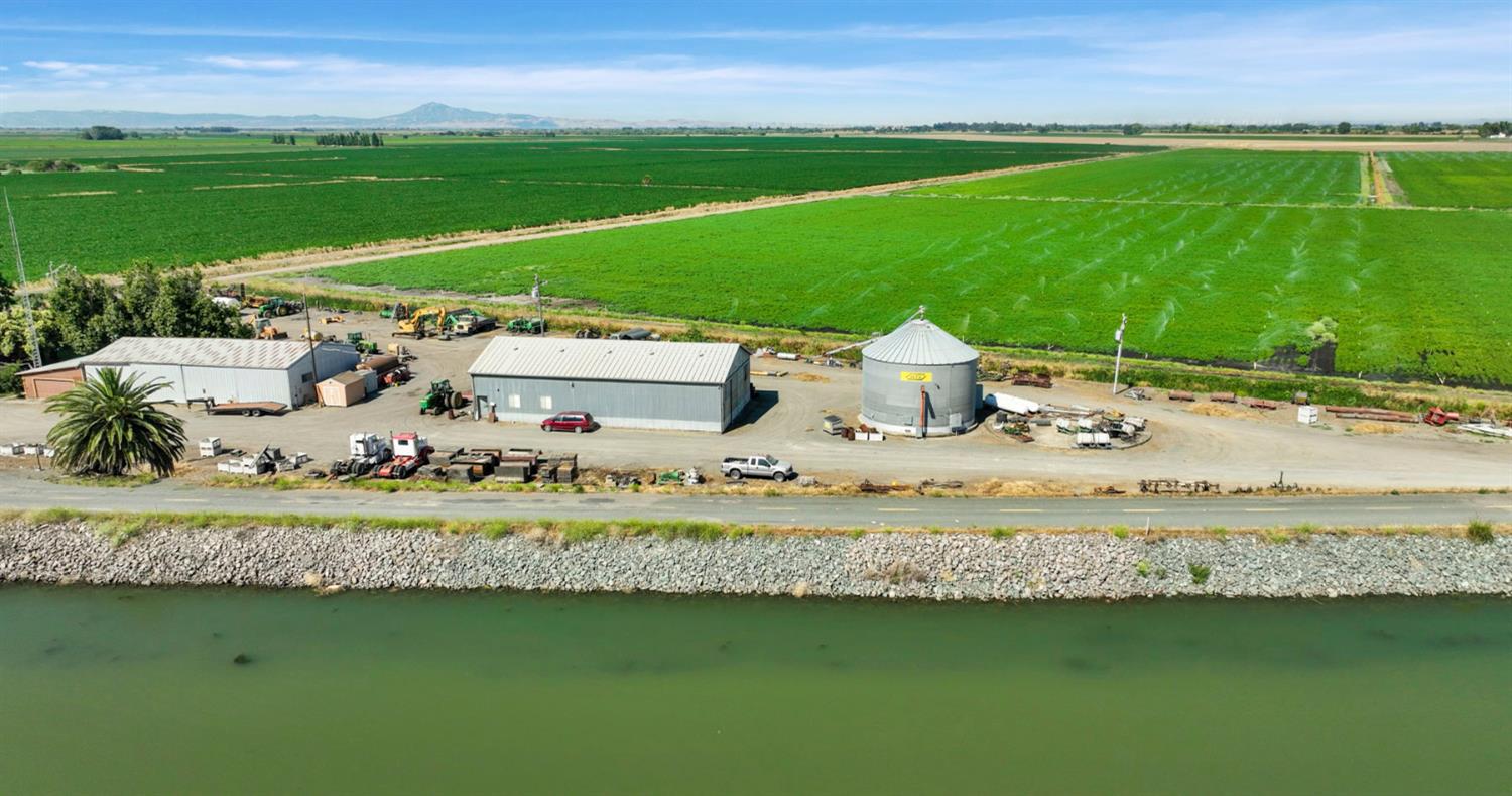 a view of a garden with a lake view