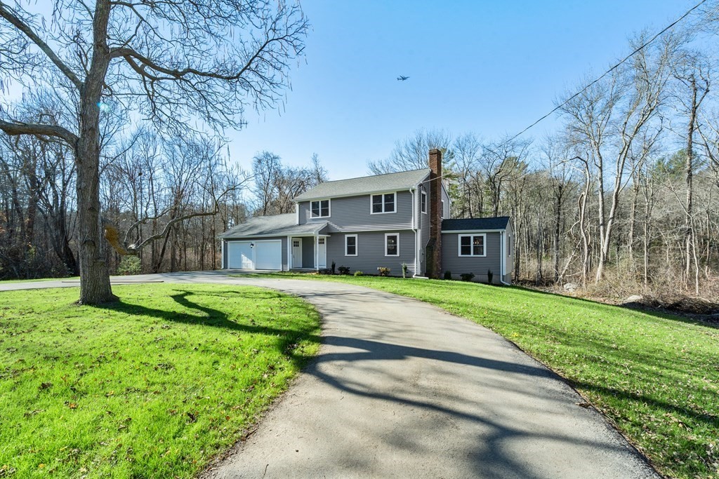 184 Booth Hill Road Scituate, MA 02066 - Photo 1 of 32 a view of a big house with a big yard and large trees