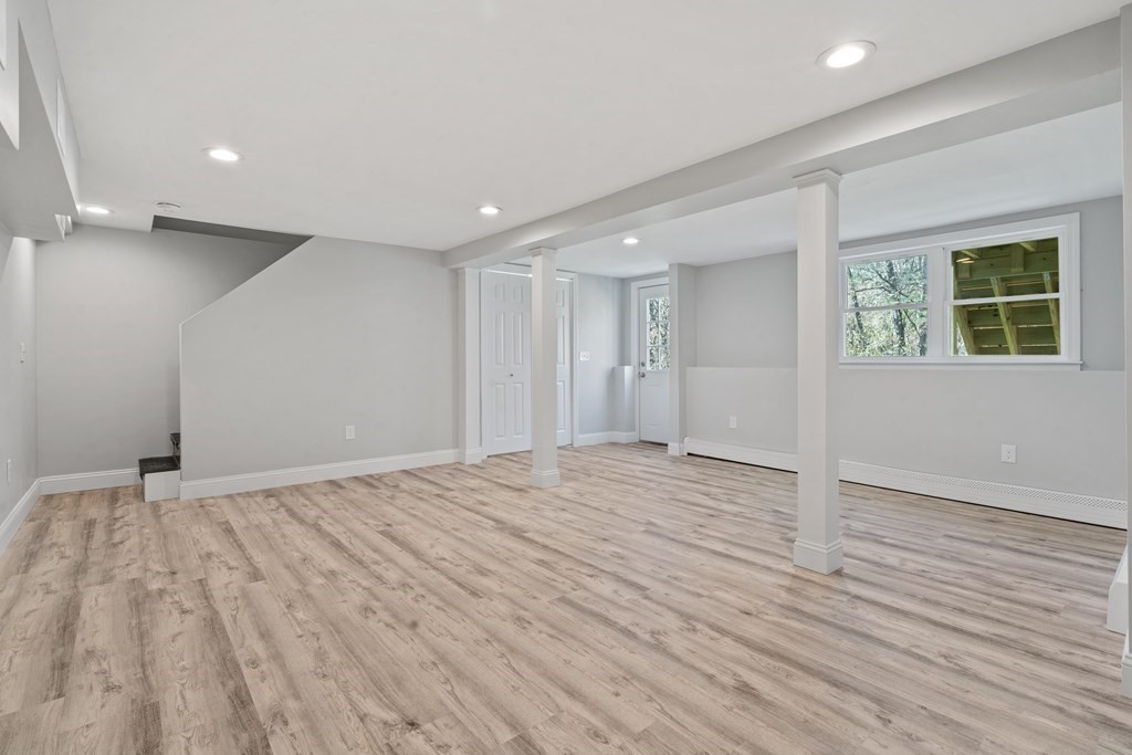 184 Booth Hill Road Scituate, MA 02066 - Photo 16 of 32 a view of an empty room with wooden floor and windows