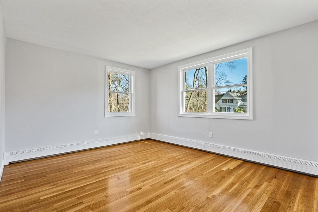 184 Booth Hill Road Scituate, MA 02066 - Photo 26 of 32 a view of an empty room with window and wooden floor