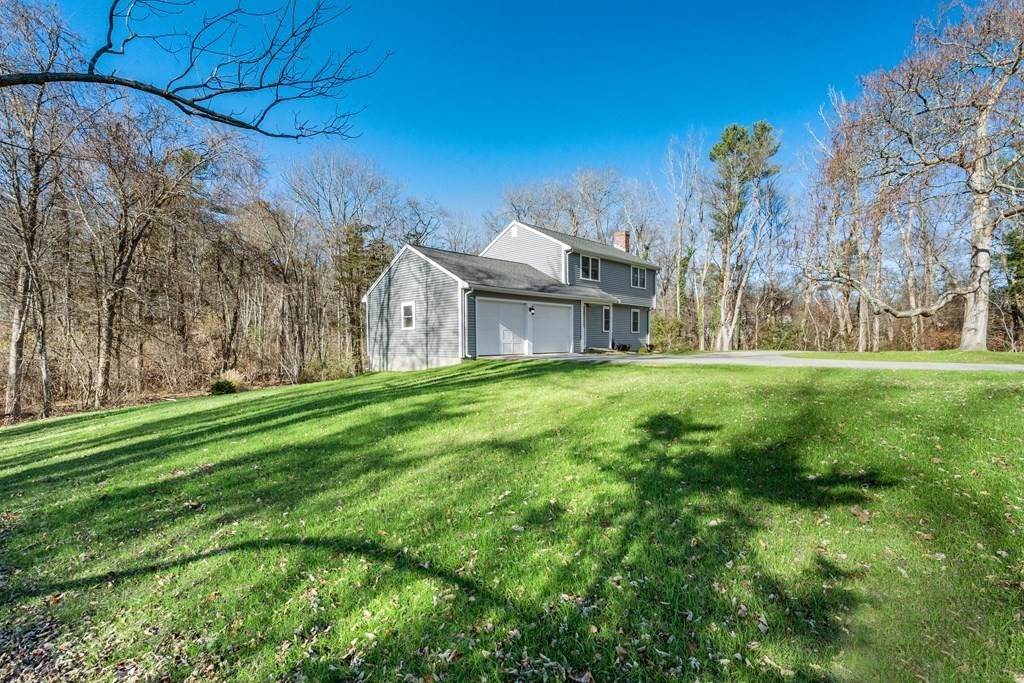 184 Booth Hill Road Scituate, MA 02066 - Photo 29 of 32 a backyard of a house with lots of green space