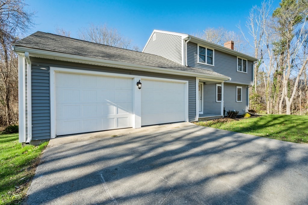 184 Booth Hill Road Scituate, MA 02066 - Photo 30 of 32 a front view of a house with a yard and garage