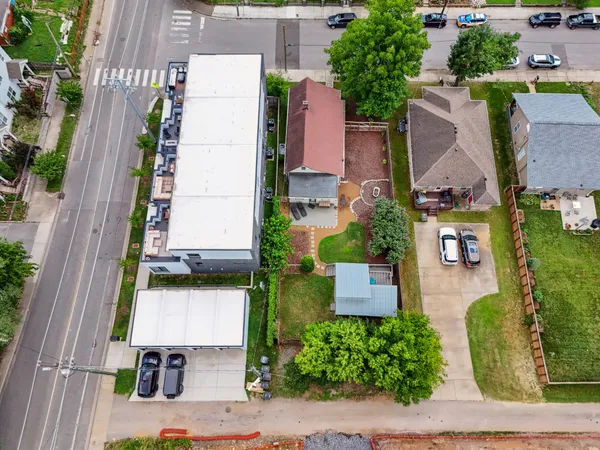 an aerial view of residential houses with outdoor space