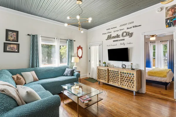 a living room with furniture and a flat screen tv