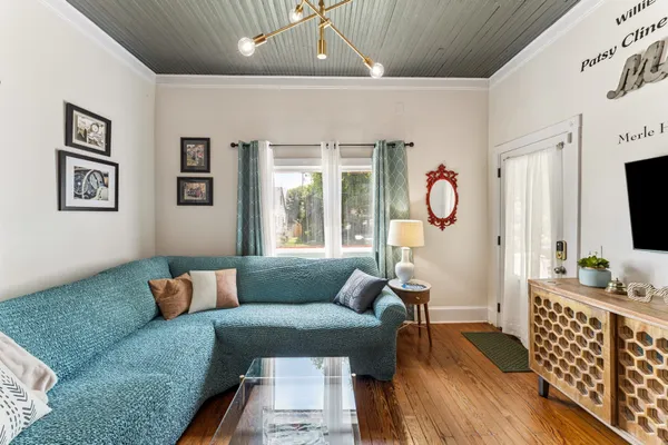 a living room with furniture and a flat screen tv