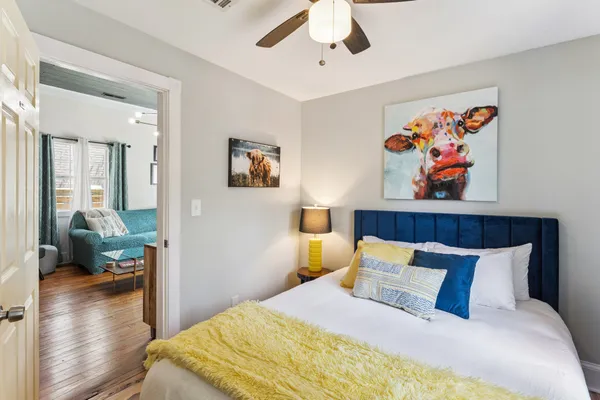 a bedroom with a bed and a window
