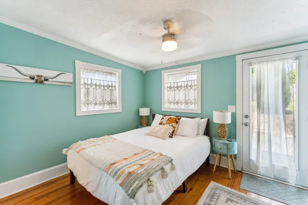 a bedroom with a bed and a window