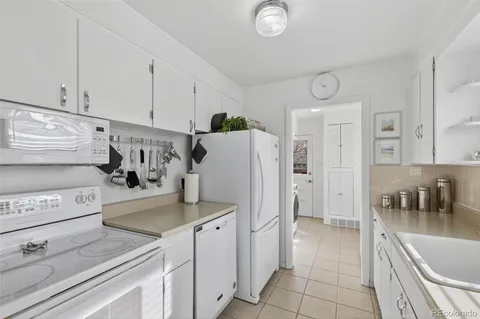 a kitchen with cabinets a sink and a stove