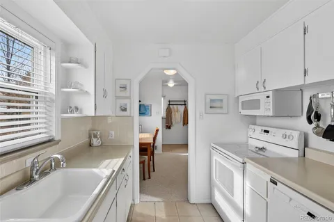 a view of a that has a flower pot and a window