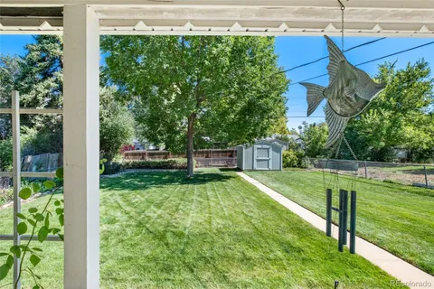 a view of a big yard with a house