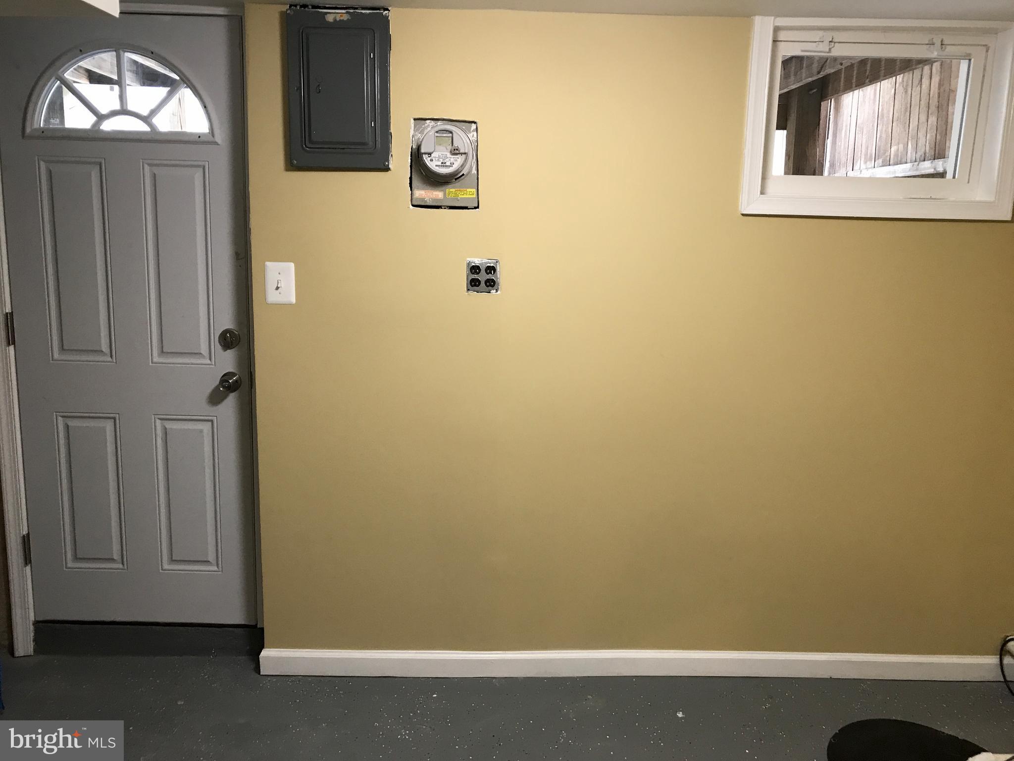505 Welbrook Road Baltimore, MD 21221 - Photo 21 of 27 a view of a small space with wooden floor and a window