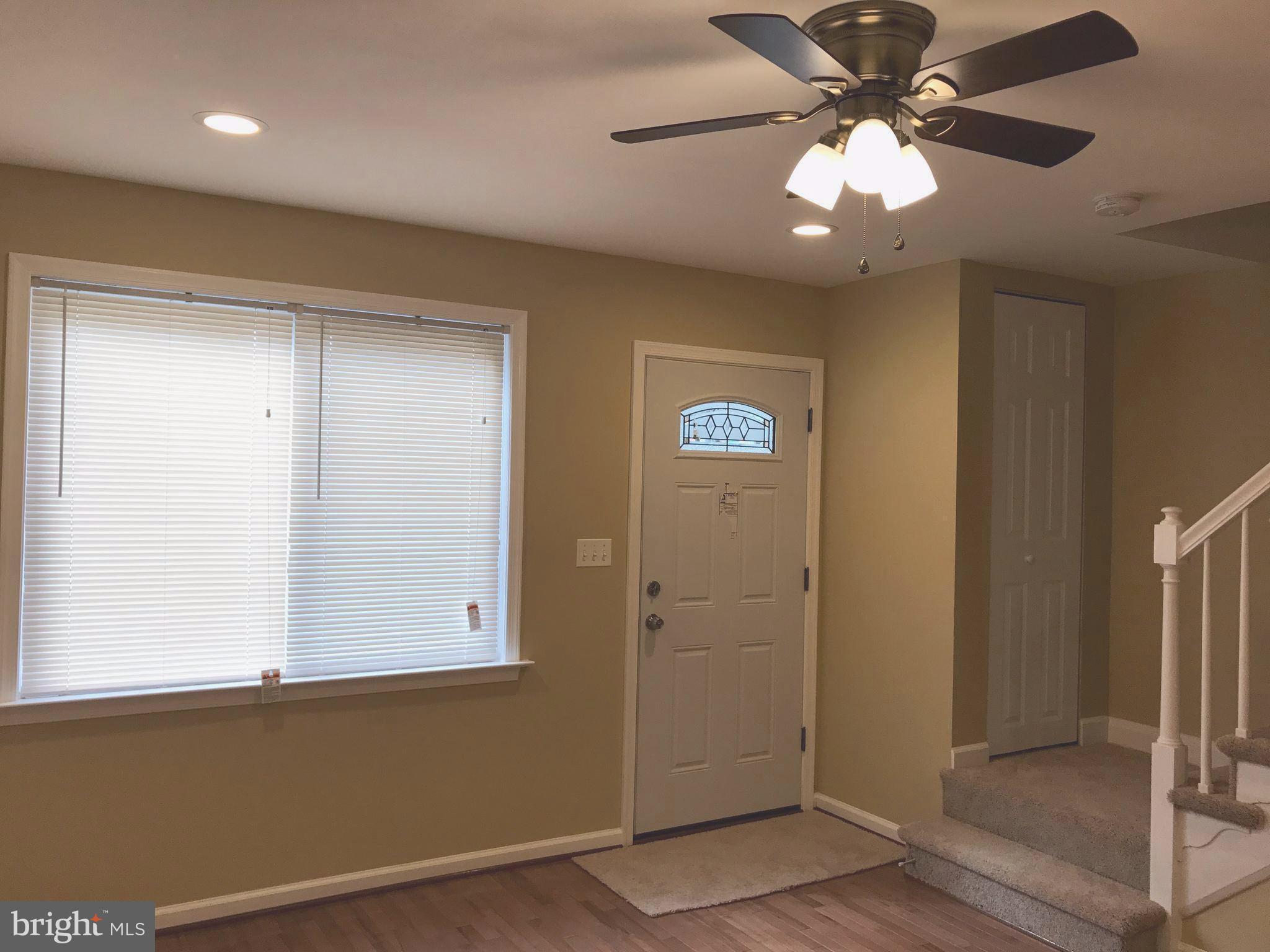 505 Welbrook Road Baltimore, MD 21221 - Photo 4 of 27 a view of a livingroom with a chandelier fan