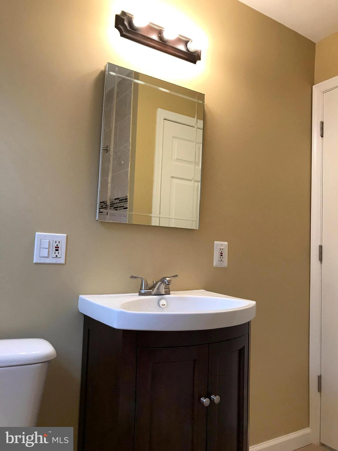 505 Welbrook Road Baltimore, MD 21221 - Photo 9 of 27 a bathroom with a sink and a toilet