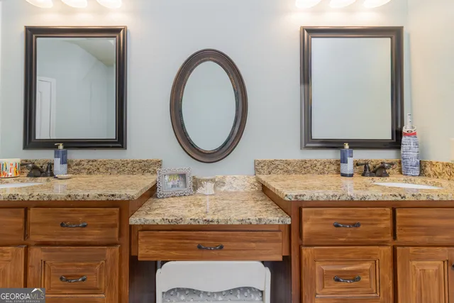 a bedroom with furniture and a flat screen tv