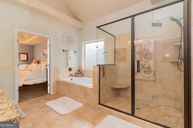 a bedroom with a bed and chair