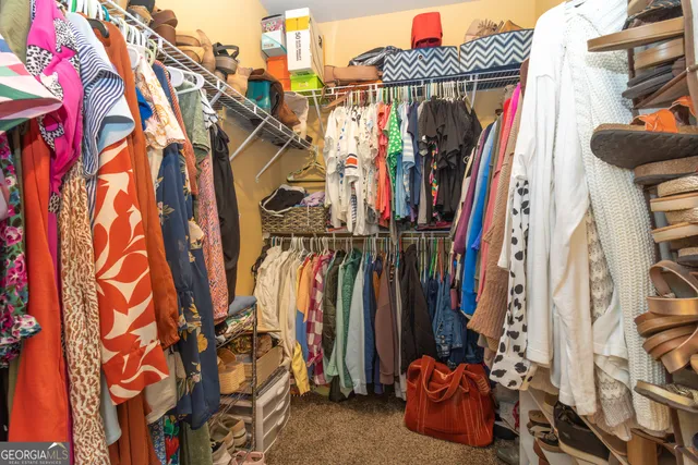 a kitchen with granite countertop stove top oven and cabinets