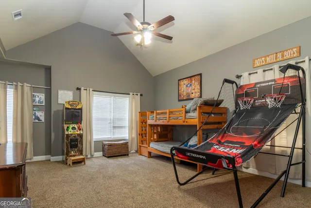 a kitchen with granite countertop stainless steel appliances a sink microwave and stove